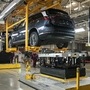 Employees install batteries onto an electric sport utility vehicle at the Nio  production facility in China. (Bloomberg)