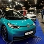 People gather next to the Volkswagen ID.3 electric car during the International Motor Show. (File Photo) (REUTERS)
