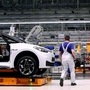 An employee of German car maker Volkswagen works on an assembly line to produce the Volkswagen ID.3 electric car model at the Volkswagen car factory in Zwickau, eastern Germany. (File photo) (AFP)