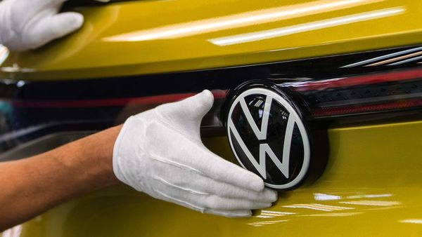 An employee carries out final quality checks on a Volkswagen ID.4 sports utility vehicle (SUV) at the Volkswagen AG electric automobile factory in Zwickau, Germany. (Bloomberg)