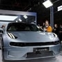 Visitors check a Zeekr 001, a model from Geely's new premium electric vehicle brand Zeekr, at its factory in China. (REUTERS)