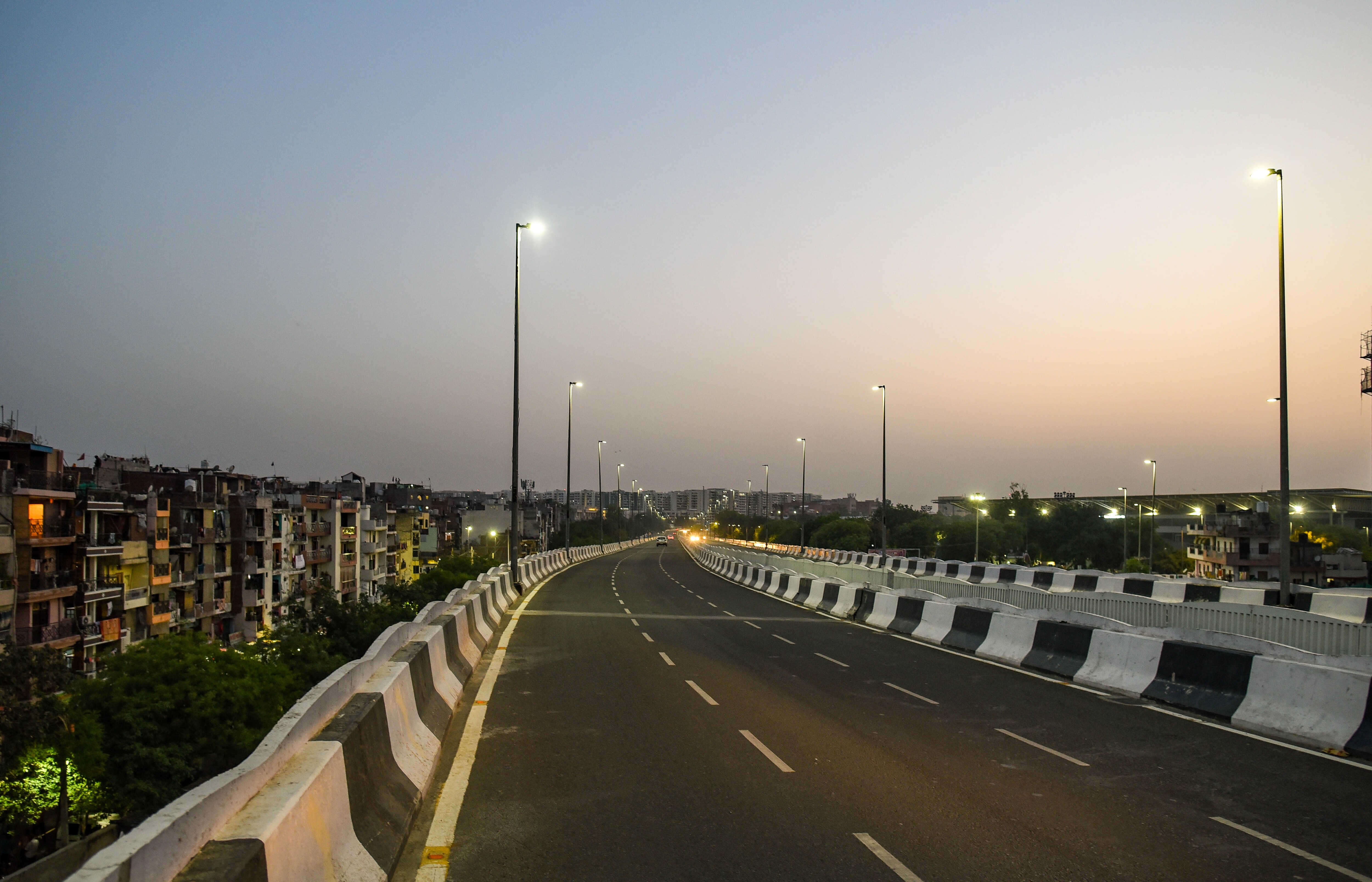 A view of an empty road in Delhi during a weekend curfew. A view of an empty road in Delhi during a weekend curfew.