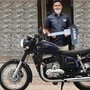 Railways Pointsman Mayur Shelke poses next to his Jawa forty two Golden Stripes Nebula Blue motorcycle he received as token of appreciation for his heroics (right)