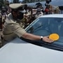 Mumbai Police Commissioner Hemant Nagarale putting up stickers on vehicles carrying citizens who work in the Emergency Services. (File photo)