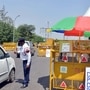Police check vehicle at a checkpoint set up on road in Noida-Delhi Border.