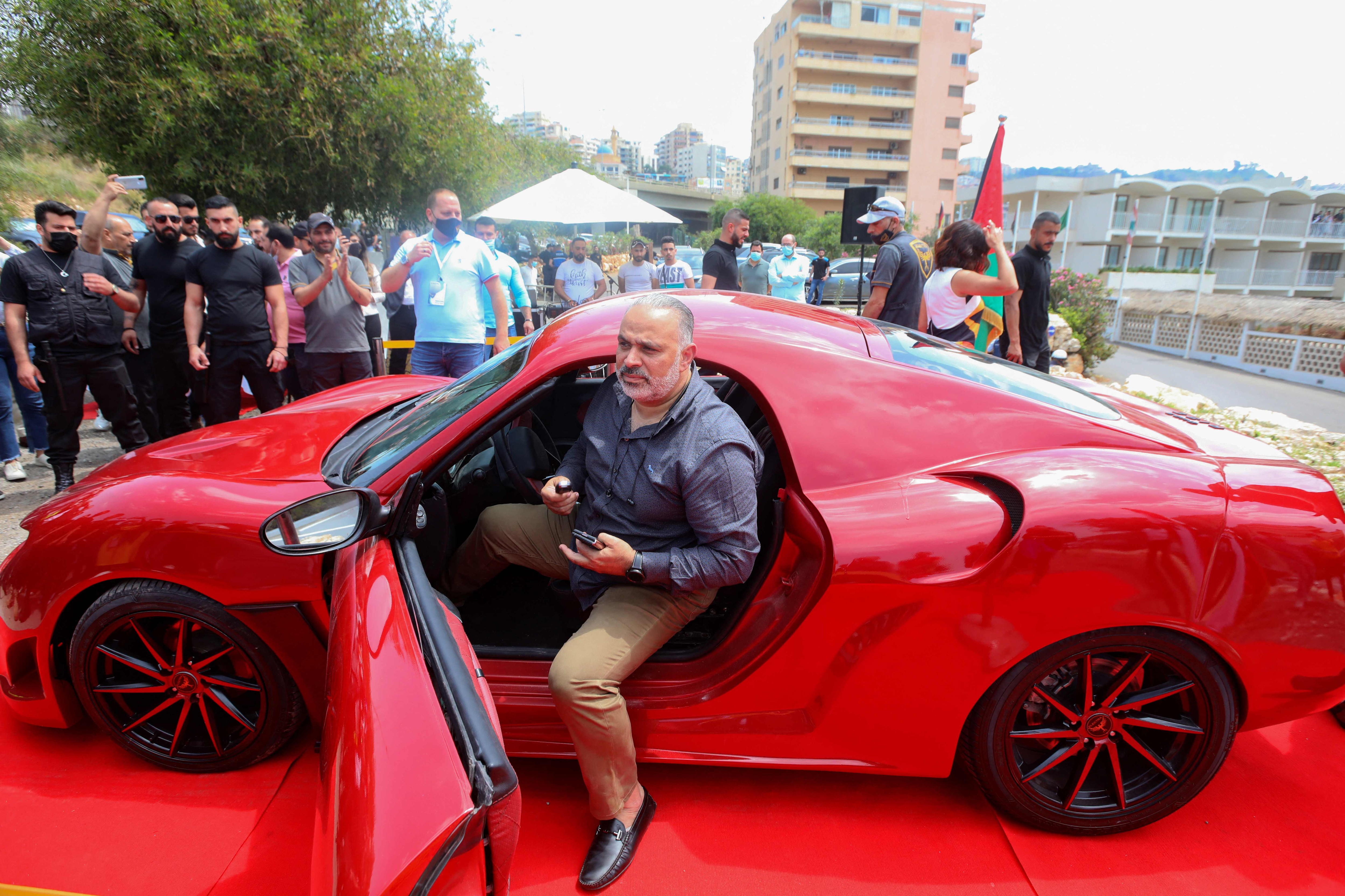 Lebanese-born Palestinian businessman Jihad Mohamad, arrives in the Quds Rise - red electric sports car. Lebanese-born Palestinian businessman Jihad Mohamad, arrives in the Quds Rise - red electric sports car.