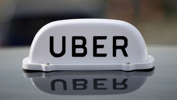 The Logo of taxi company Uber is seen on the roof of a private taxi. (File photo) (REUTERS)