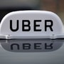 The Logo of taxi company Uber is seen on the roof of a private taxi. (File photo) (REUTERS)