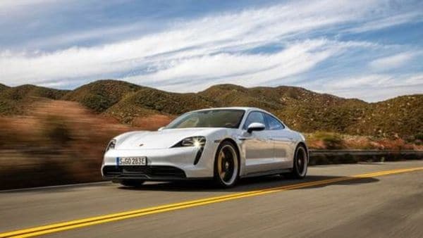 This photo provided by Porsche shows the 2020 Porsche Taycan, a premium electric sedan with an estimated range of 227 miles. Edmunds has noted that this car is capable of getting more range in real-world conditions. (Courtesy of Porsche Cars North America via AP) (AP)