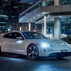 Porsche has taken its all-electric Taycan to Australia and at the debut, the car was greeted with a dramatic display in Sydney, connecting the brand’s history with an electric future.
