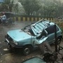 A damaged car is seen on a road after a tree fell on it due to strong winds caused by Cyclone Tauktae in Mumbai. (REUTERS)
