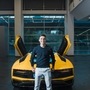 Juventus Striker Paulo Dybala poses with the Lamborghini Aventador he received.