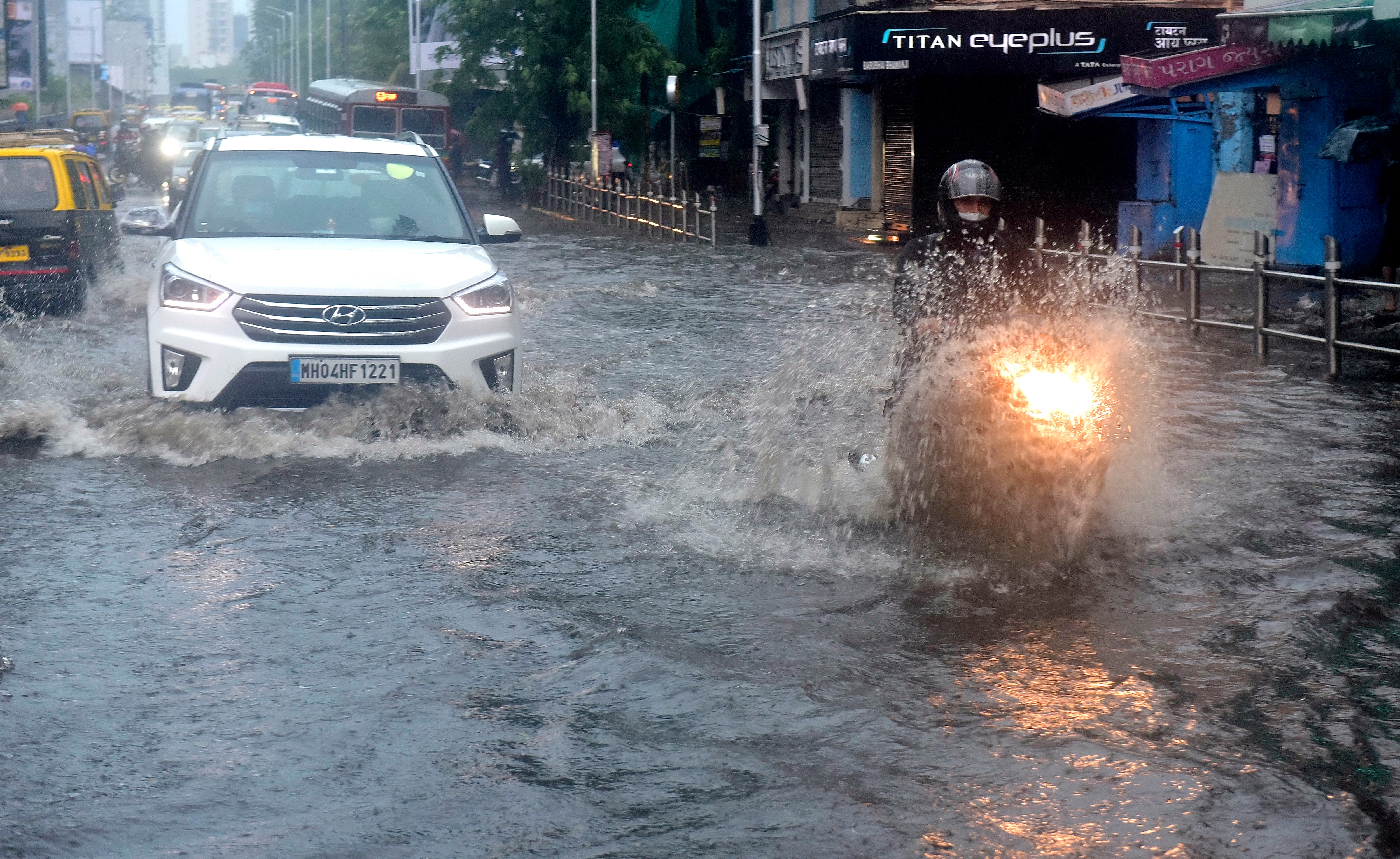 Vehicles wade through water-logged Dadar TT circle.