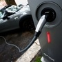 An electric car is seen plugged in at a charging station. (file photo) (REUTERS)