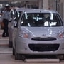 A security guard walks past Nissan Micra cars lined at the Renault-Nissan Alliance auto plant in Chennai. (File photo) (REUTERS)