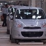 A security guard walks past Nissan Micra cars lined at the Renault-Nissan Alliance auto plant in Chennai. (File photo) (REUTERS)