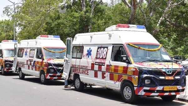 Tata Winger ambulances line up during a vehicle induction ceremony in Gandhinagar.