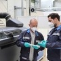 Employees in the middle of quality check of components produced using the binder jetting process in Wolfsburg. (Volkswagen)