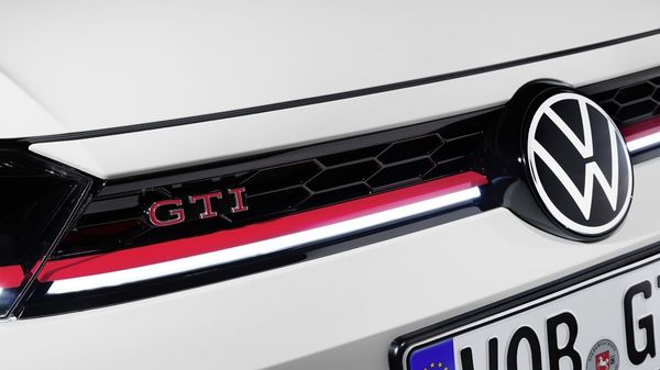 The distinctive GTI hallmarks of the front edge remain the striking red GTI logo on the radiator grille, the honeycomb vents and the surrounding red stripe above the daytime running light trim. The distinctive GTI hallmarks of the front edge remain the striking red GTI logo on the radiator grille, the honeycomb vents and the surrounding red stripe above the daytime running light trim.