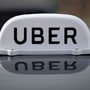The Logo of taxi company Uber is seen on the roof of a private taxi. (File photo) (REUTERS)
