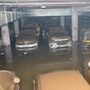 Cars, bikes and three-wheelers are seen submerged in the rainwater at an underground parking lot near Mumbai. (HT PHOTO)