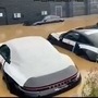 Brand new Porsches half-drowned in water. (Image source: alainfeld/ TikTok)