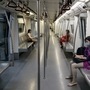 Passengers wear protective masks while travelling on a Delhi Metro train. (File photo) (Bloomberg)