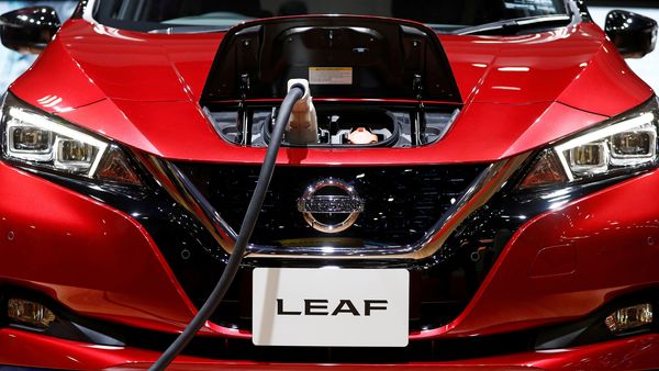FILE PHOTO: A charging cable is attached to a Nissan Leaf electric car at the Tokyo Motor Show. (REUTERS)