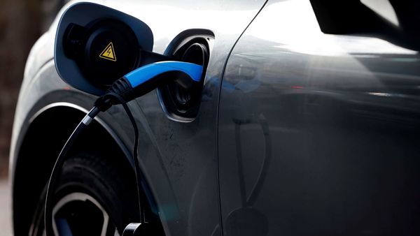 A charging cable is pictured plugged into a Volvo electric vehicle (EV), parked in a parking bay reserved for electric vehicles, in London on November 18, 2020. (Representational Image) (AFP)