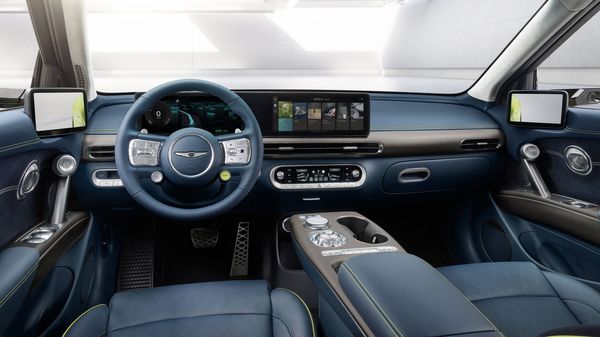 The interior of the Genesis GV60 has similarities with Hyundai Ioniq 5 and Kia EV6. The dual-screen digital display dominates the dashboard, while a large centre console houses both storage space and the vehicle's main controls. The interior of the Genesis GV60 has similarities with Hyundai Ioniq 5 and Kia EV6. The dual-screen digital display dominates the dashboard, while a large centre console houses both storage space and the vehicle's main controls.