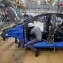 FILE PHOTO: Workers assemble a Tata Tiago car inside the Tata Motors car plant in Sanand, on the outskirts of Ahmedabad. (REUTERS)
