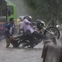 A motorist tries his best to get to safer ground in order to seek a clearer passage on water-logged roads. (Sanchit Khanna/HT PHOTO)