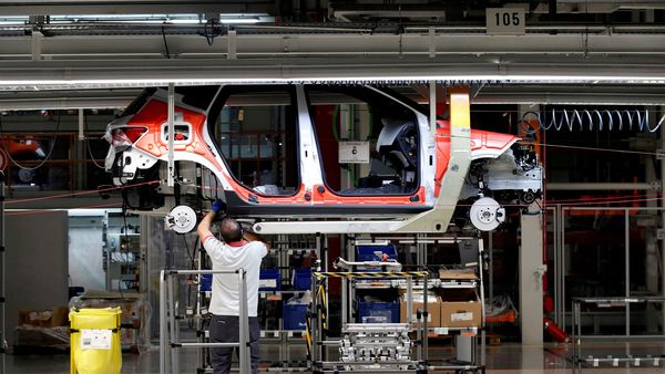 FILE PHOTO: Workers assemble vehicles on the assembly line of a car factory. (Photo used for representational purpose only) (REUTERS)