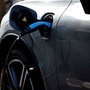 A charging cable is pictured plugged into a an electric vehicle (EV). (File photo used for representational purpose only) (AFP)