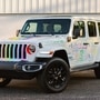 The rainbow-coloured Jeep Wrangler 4xe that led the pride parade in Detroit was accompanied by other Jeep SUVs.