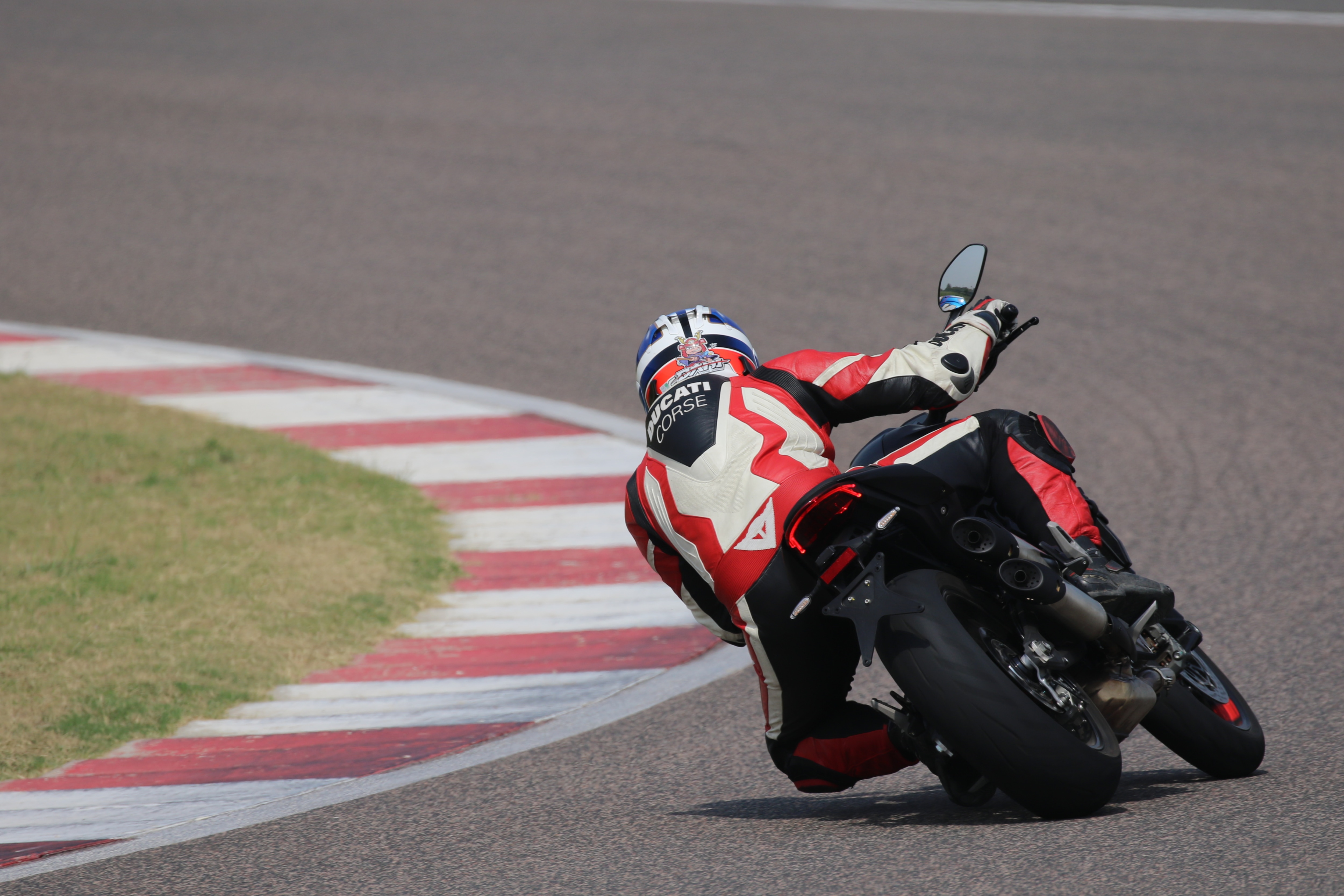 The grippy Pirelli Diablo Rosso III tires on the new Ducati Monster contribute to quicker transitions.