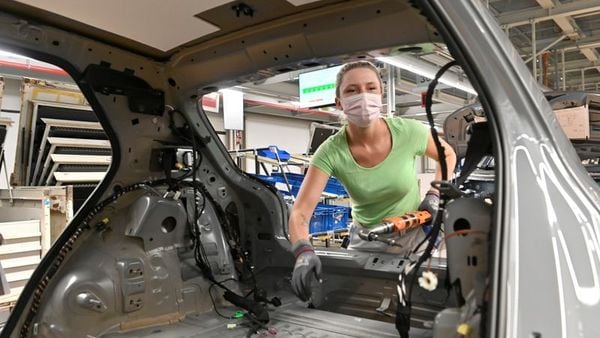 A Volkswagen technician at work at the assembly line of the ID.3 electric car in Zwickau, Germany. (File Photo) (REUTERS)