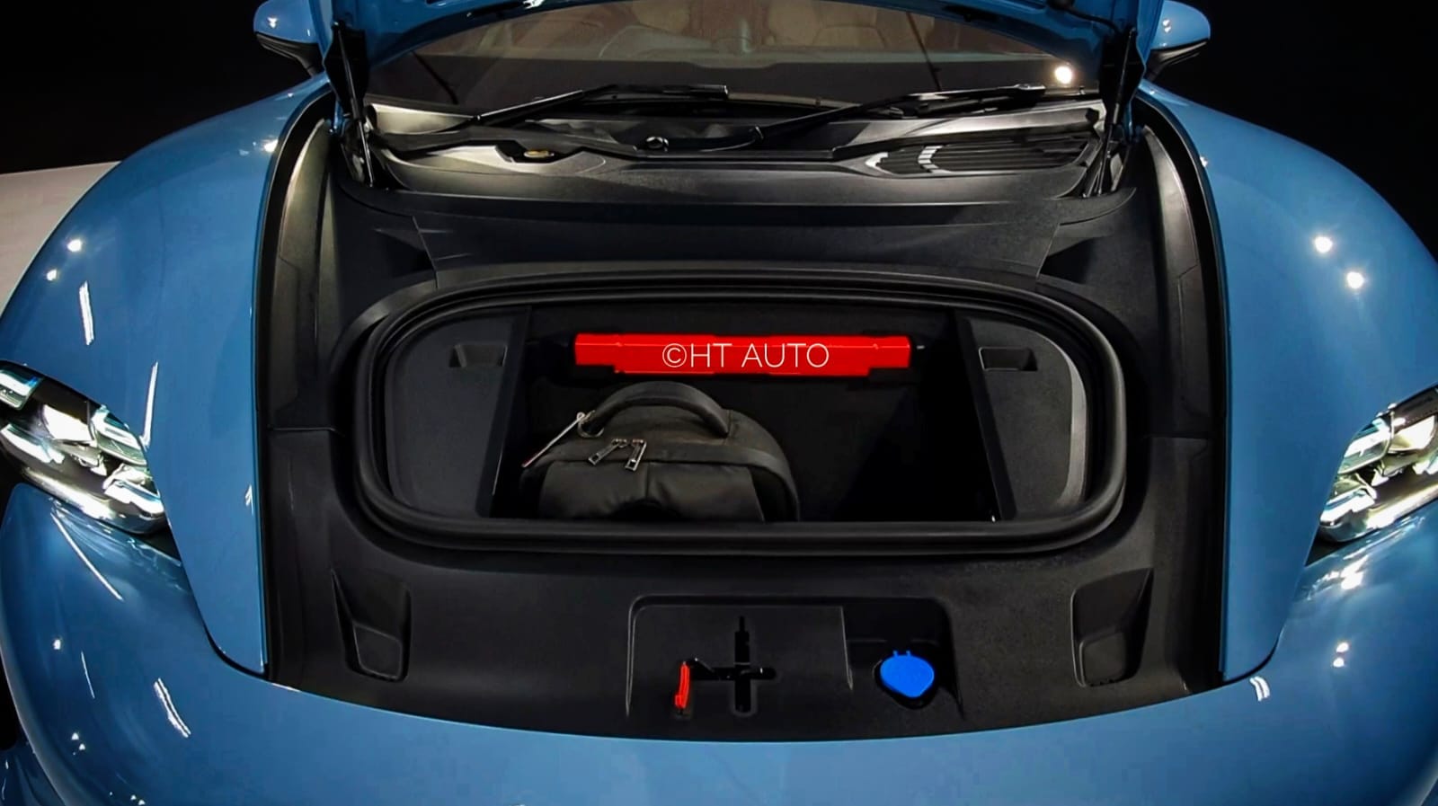 And since there is no engine, the front lid of the Taycan EV opens up for some neat storage space. And since there is no engine, the front lid of the Taycan EV opens up for some neat storage space.
