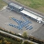 The 100-metre long Trident logo created using 80 Maserati Grecale SUV prototypes.