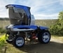 The Straddle concept tractor has a large single door and gets rotating seats.