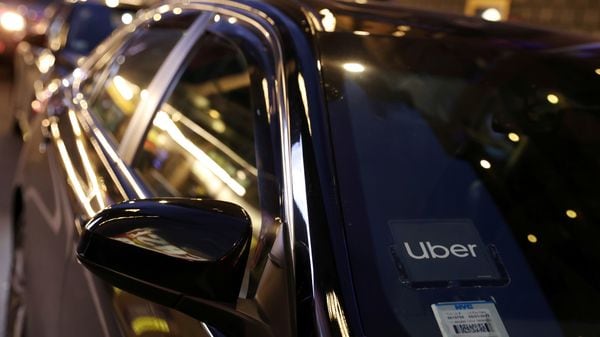 FILE PHOTO: The logo for Uber Technologies is seen on a vehicle in Manhattan, New York City, New York, US. (Reuters)