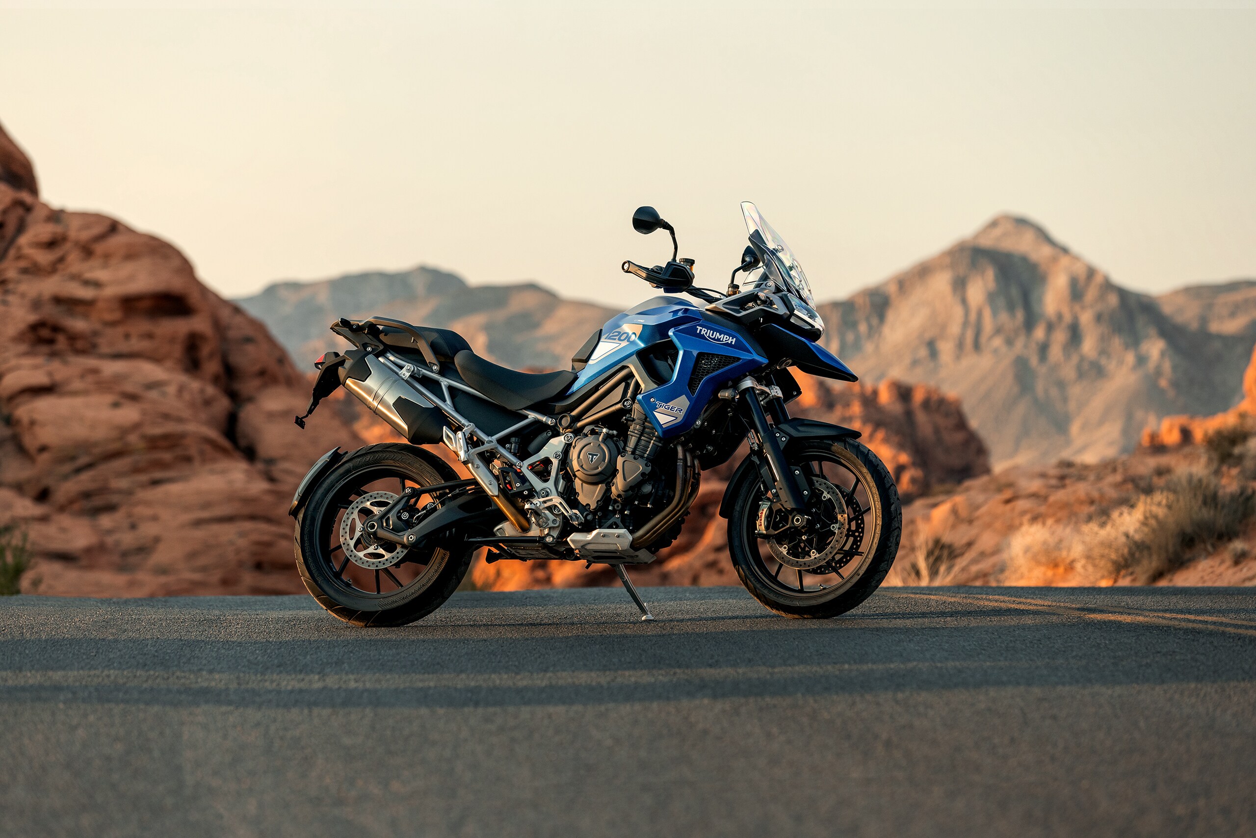 The  Triumph Tiger 1200 GT Pro and GT Explorer come in Snowdonia White, Sapphire Black, and Lucerne Blue options.