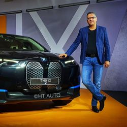 Vikram Pawah, President at BMW Group India, poses next to a BMW iX electric SUV, which was launched in India at a price of  <span class='webrupee'>₹</span>1.16 crore (ex-showroom). (HT Auto/Sabyasachi Dasgupta)