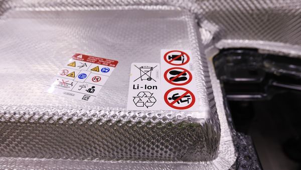 File photo of a lithium-ion battery pack with a recycling symbol. File photo of a lithium-ion battery pack with a recycling symbol.