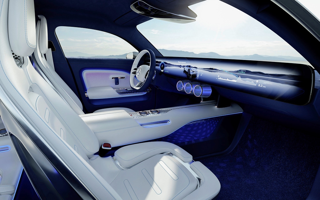 The dark blue theme inside the cabin points out to the car's electric character. The dashboard looks minimalist and digitized at the same time with an integrated large display that acts as instrument display and an infotainment screen as well. The dark blue theme inside the cabin points out to the car's electric character. The dashboard looks minimalist and digitized at the same time with an integrated large display that acts as instrument display and an infotainment screen as well.