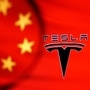 FILE PHOTO: Chinese flag and Tesla logo seen through a magnifier in this illustration  (REUTERS)