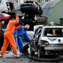 Twin brothers Steven and Brian Krijger use hammers to scrap a car to express their frustration as the Netherlands undergoes another lockdown in Vijfhuizen, Netherlands. (REUTERS)