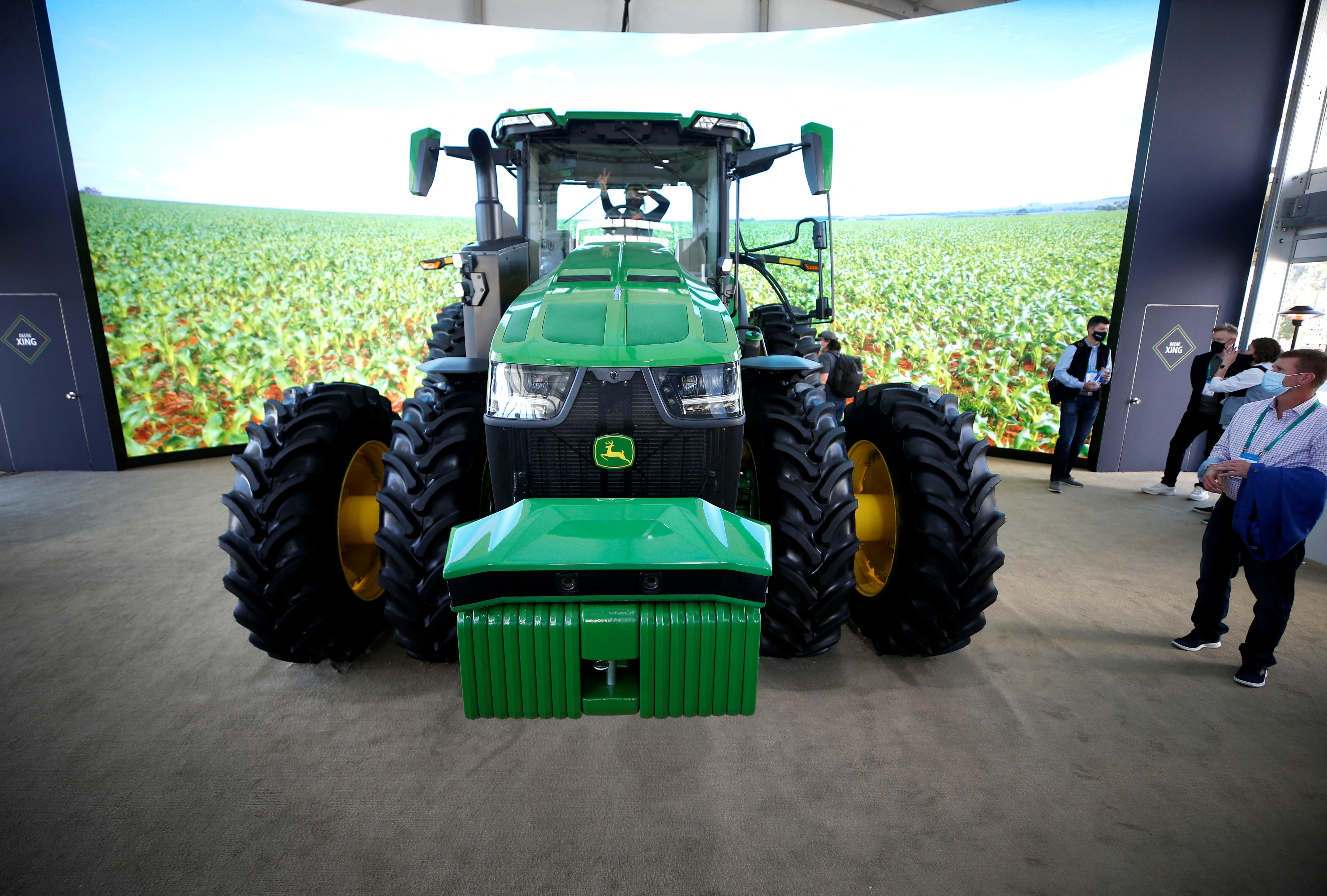 The John Deere 8R autonomous tractor is displayed at the Las Vegas Convention Center. It is based on the manufacturer's 8R tractor and comes with a TruSet-enabled chisel plough, GPS guidance system, and a host of other advanced technologies. (REUTERS)