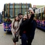 A woman clicks a selfie in front of the first all-electric bus in DTC fleet. (Ayush Sharma)