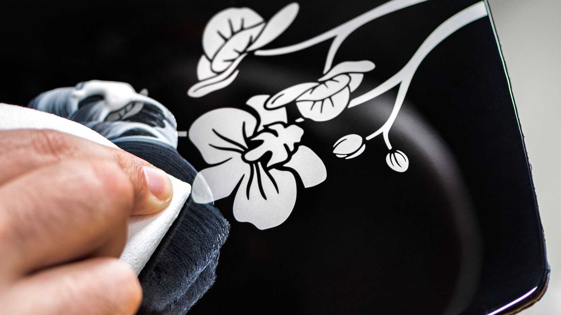 Rolls-Royce Phantom Orchid uses a unique, hand-sculpted silk artwork behind a pure glass that runs uninterrupted across the car's fascia. Rolls-Royce Phantom Orchid uses a unique, hand-sculpted silk artwork behind a pure glass that runs uninterrupted across the car's fascia.